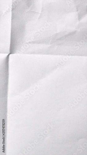 Abstract white paper texture with soft folds and shadows.