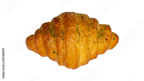 фотографія Baked butter croissant topped with chopped pistachios