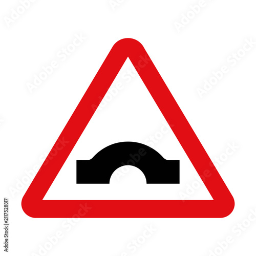 Fotografie Red triangle road sign with black hump symbol indicating a bump in the road ahea