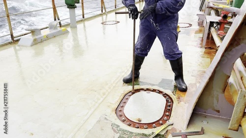 seafarar work during the voyage. manhole of water ballast tank unscrew and opening.