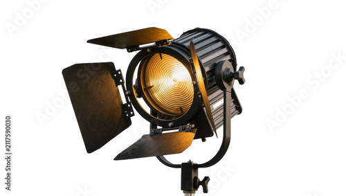 Konstfotografi Professional black fresnel spotlight with barn doors emitting warm yellow light,