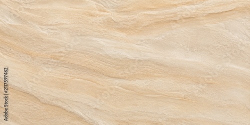 Creamy beige marble texture with natural swirling patterns during soft studio lighting