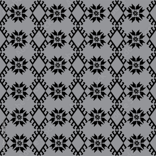 This image shows a traditional Thai fabric with an intricate geometric pattern. 