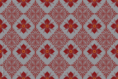 This image shows a traditional Thai fabric with an intricate geometric pattern. 