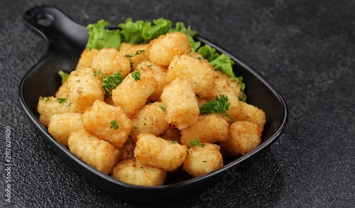 Delicious fried potatoes known as tater tots or pom pom potato