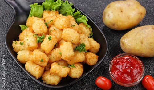 Delicious fried potatoes known as tater tots or pom pom potato