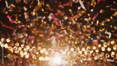 Vibrant Confetti Explosion with Bright Lights and Festive Atmosphere.