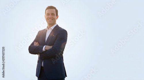 Confident Businessman Standing Outdoors Under Bright