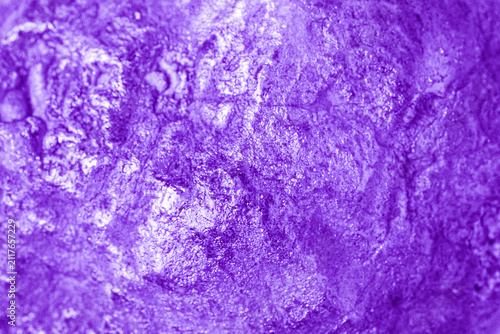 Фотография Close up of a textured geode stone surface with purple coloring