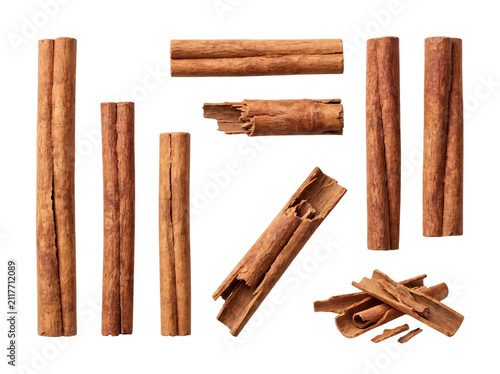 Fotografie Assortment of cinnamon sticks and broken pieces on black png isolated on transpa