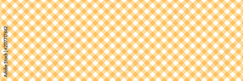 Peach and white diagonal gingham check plaid pattern background texture for fabric, picnic, and wallpaper design.