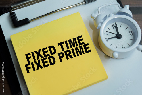 Принти на полотні Concept of fixed time and fixed prime write on sticky notes isolated on Wooden Table