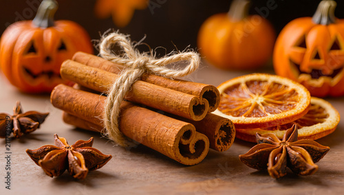 Cinnamon Sticks and Star Anise with Pumpkins on Wooden Table