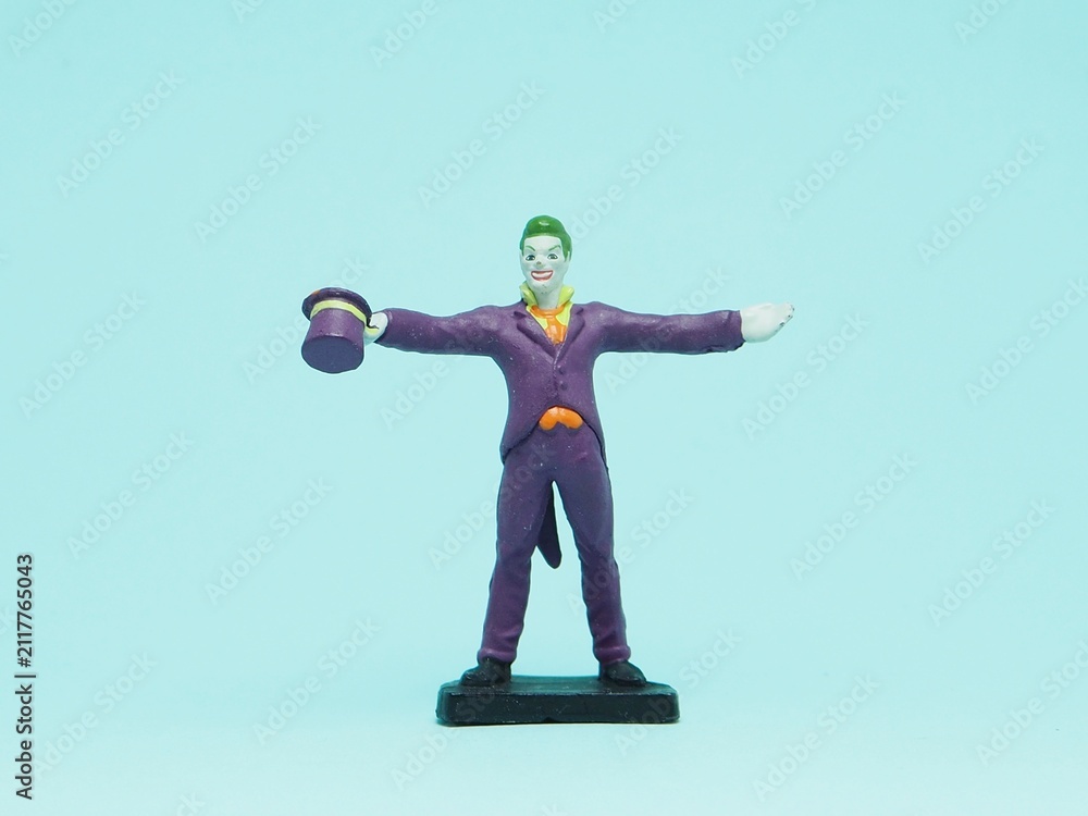 Fototapeta premium Indonesia - November 3, 2025 : Mini toy of action figure at outdoor with blurred background. Miniature photography concept design. Minifigure of Joker character from DC Comics film.