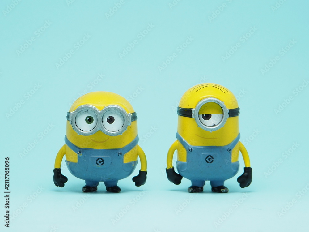 Fototapeta premium Indonesia - November 3, 2025 : Mini toy of action figure at outdoor with blurred background. Miniature photography concept design. Minions character from Despicable Me Cartoon film.