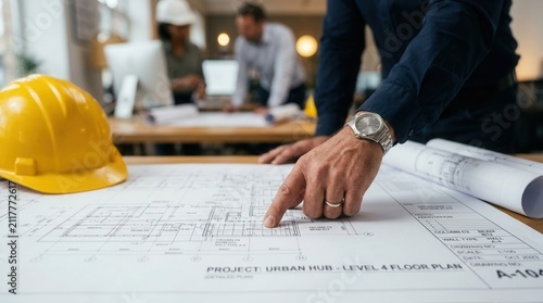 Project plans for building and infrastructure development being analyzed by engineers during a construction blueprint review