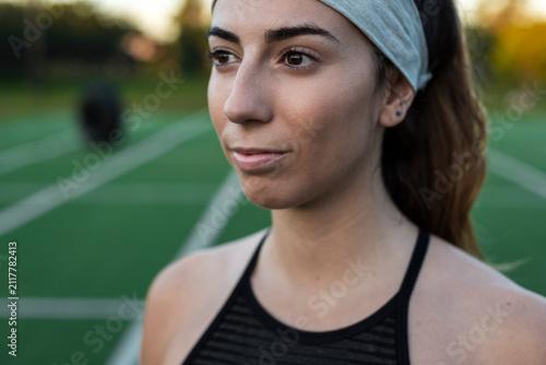 Reflective athlete facing stillness after urban workout