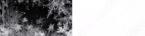Beautiful ice frost pattern with snowflakes on black background, winter frozen texture, cold weather design element, natural ice formation or christmas new year design