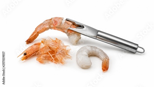 Shrimp peeling and deveining tool with fresh raw prawns isolated on white background