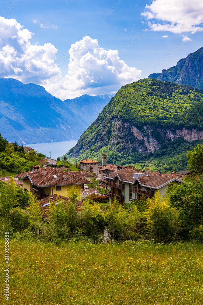 Obraz premium Village of Ville del Monte on the heights of Riva del Garda with a panoramic view of Lake Garda and the surrounding mountains, Trentino