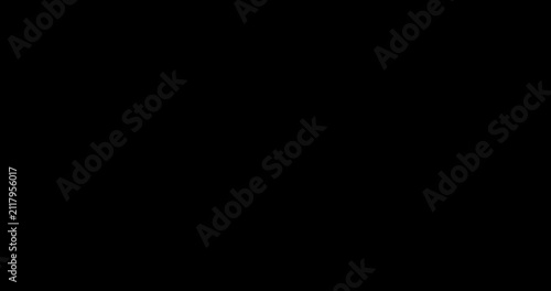 Dust sparks particles floating over black background with cinematic light effect overlay