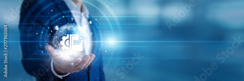 Admin professional holding a handheld scanner digitizing Document Management files for secure storage. Office manager organizing electronic archives and ensuring fast data retrieval networks.