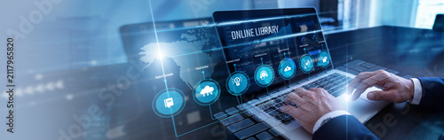 Foto Digital archivist cataloging books using laptop managing a massive Online Library database on a floating virtual screen projection