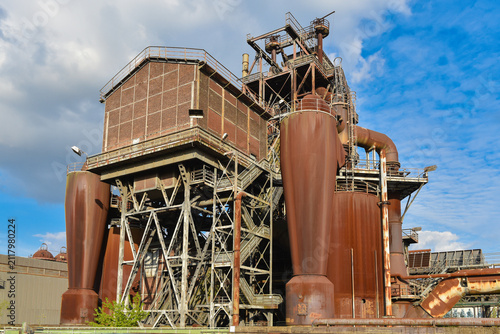 Old, rusty, abandoned factory with remnants of equipment