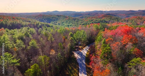 Blue Ridge Parkway in autumn. Mountain pass road between dense woods in seasonal colors in North Carolina.