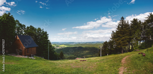Dzikowiec Ski Slope seen from the top of the mountain and the surroundings of the city of Wałbrzych seen in the distance