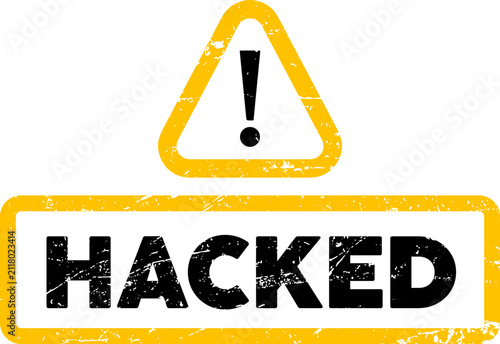 A grungy yellow rubber stamp design featuring a warning triangle and the bold black text hacked