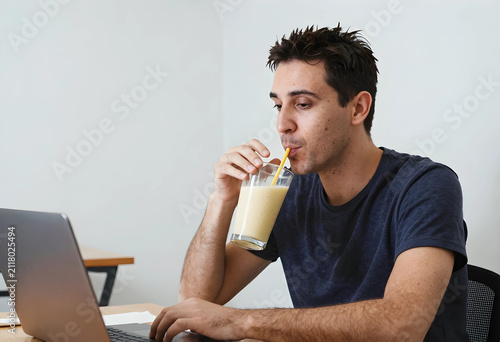 Young man drinking a health...