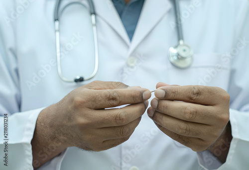 Doctors hands holding a sma...