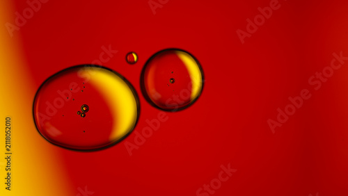 Фотография Oil drops floating in liquid creating abstract background