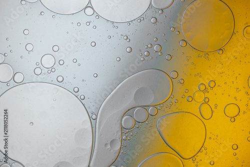 Oil and water bubbles abstract creating fluid background