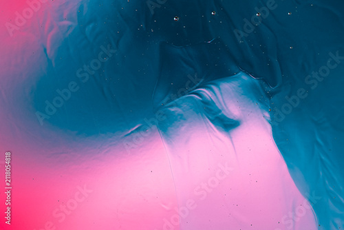 Abstract fluid gradient mixing blue and pink colors