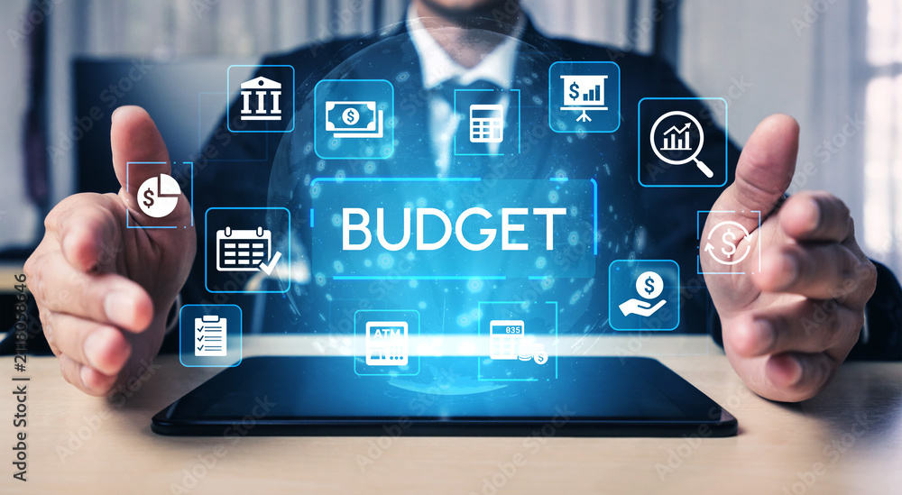 Obraz premium Businessman Presenting Digital Budget Concept with Virtual Icons for Financial Planning and Management on Modern Tablet Device. Entropy.