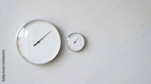 Weather linked gauge dial with barometric indicator on grey wall, climate data driven insurance pricing concept art horizontal with copy space