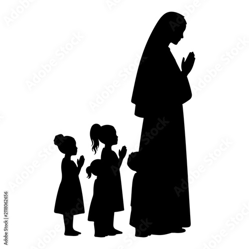 Canvas Print Silhouette of Woman and Children Praying Together.