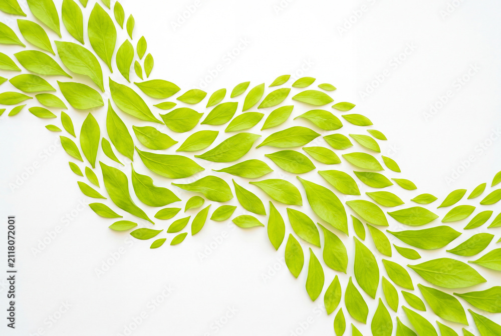 Obraz premium Flowing wave pattern made of bright lime green leaves
