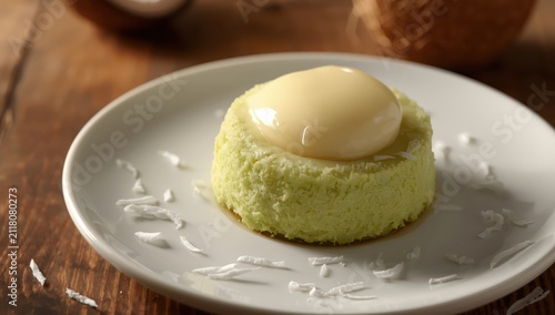 The pandan cake with coconut custard on top is beautifully plated; it's delectable and has a soft texture.