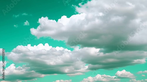 Vibrant teal sky with an array of fluffy white cumulus clouds, creating a serene and expansive natural backdrop, symbolizing clarity and freedom