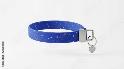 Blue fabric keychain with white geometric pattern and metallic heart charm on white background