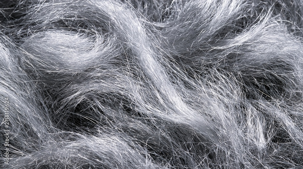 Obraz premium Close-up flat lay of steel wool fine fibres texture, delicate tangled silvery metal fibres creating organic cloud-like surface, studio flat lighting, ultra high resolution material background 