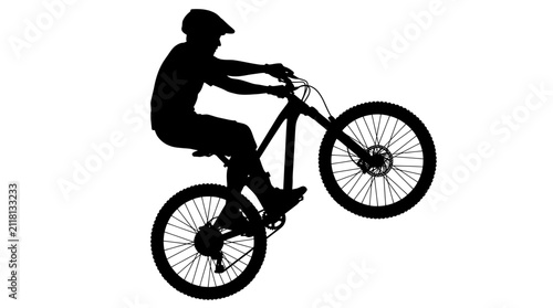 Quadro su tela Mountain biker performing wheelie stunt silhouette.
