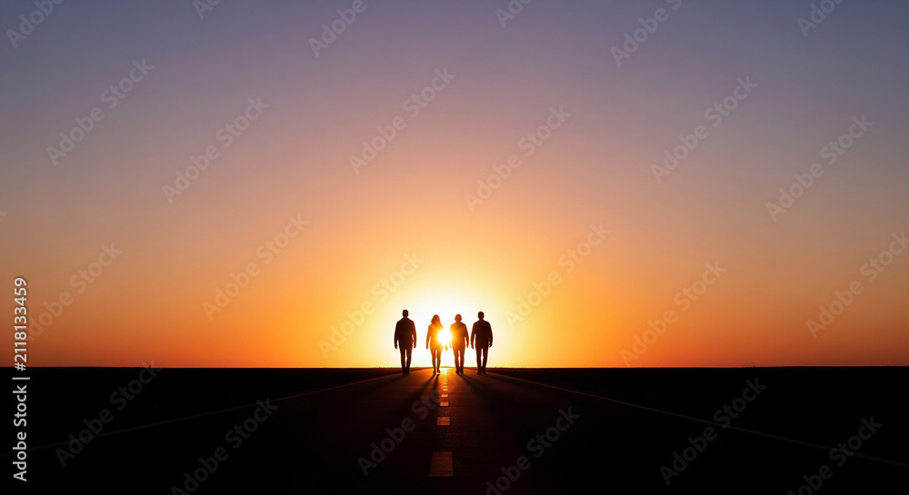 Fototapeta premium Silhouettes of business people walking into massive orange sunset perfect for visionary corporate leadership and future teamwork concept
