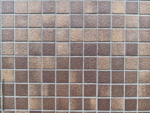 Fotografie Tiled surface displays earthy tones in a uniform grid