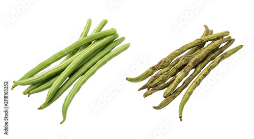 Fresh green okra pods ready for cooking in a garden.