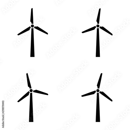 Four Black Silhouette Wind Turbines Isolated on White Background.
