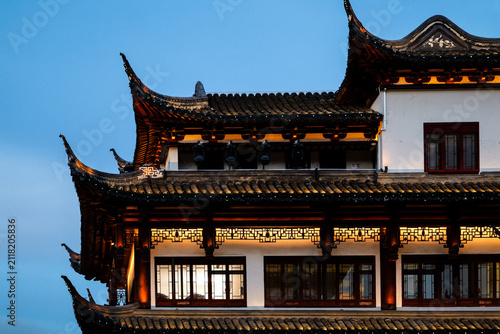 A close-up of a gorgeous Chinese palace building at blue hour